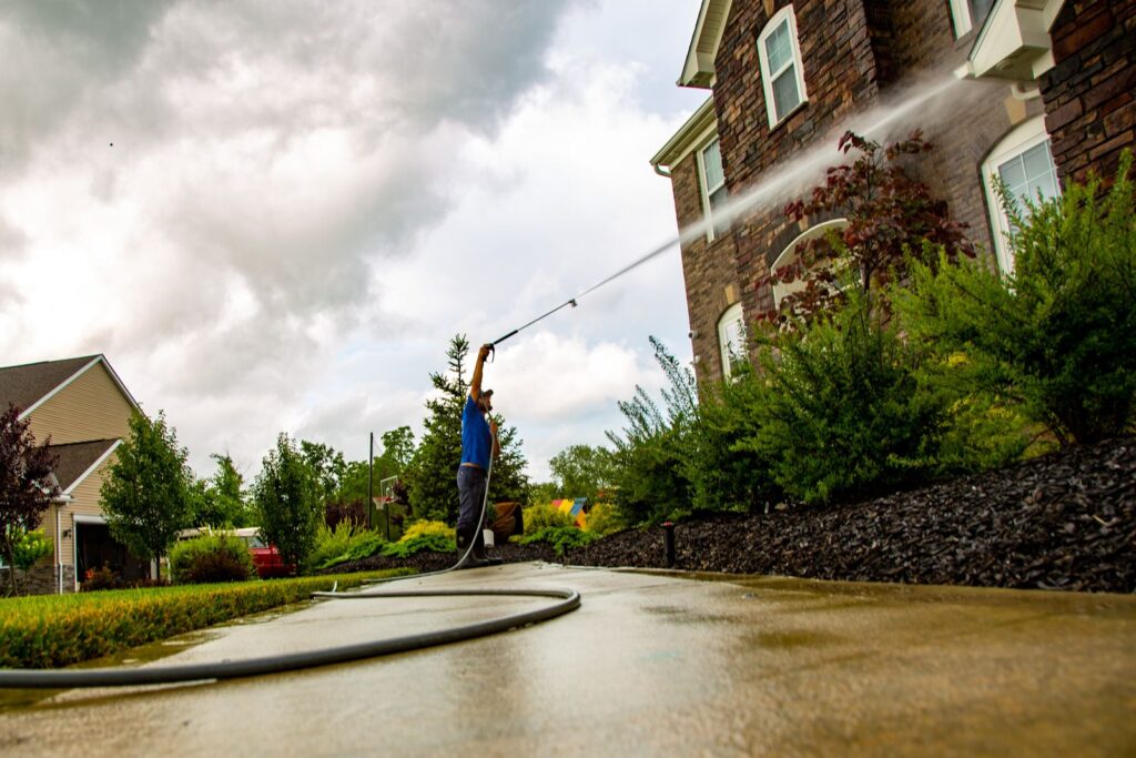 Professional power washing house exterior