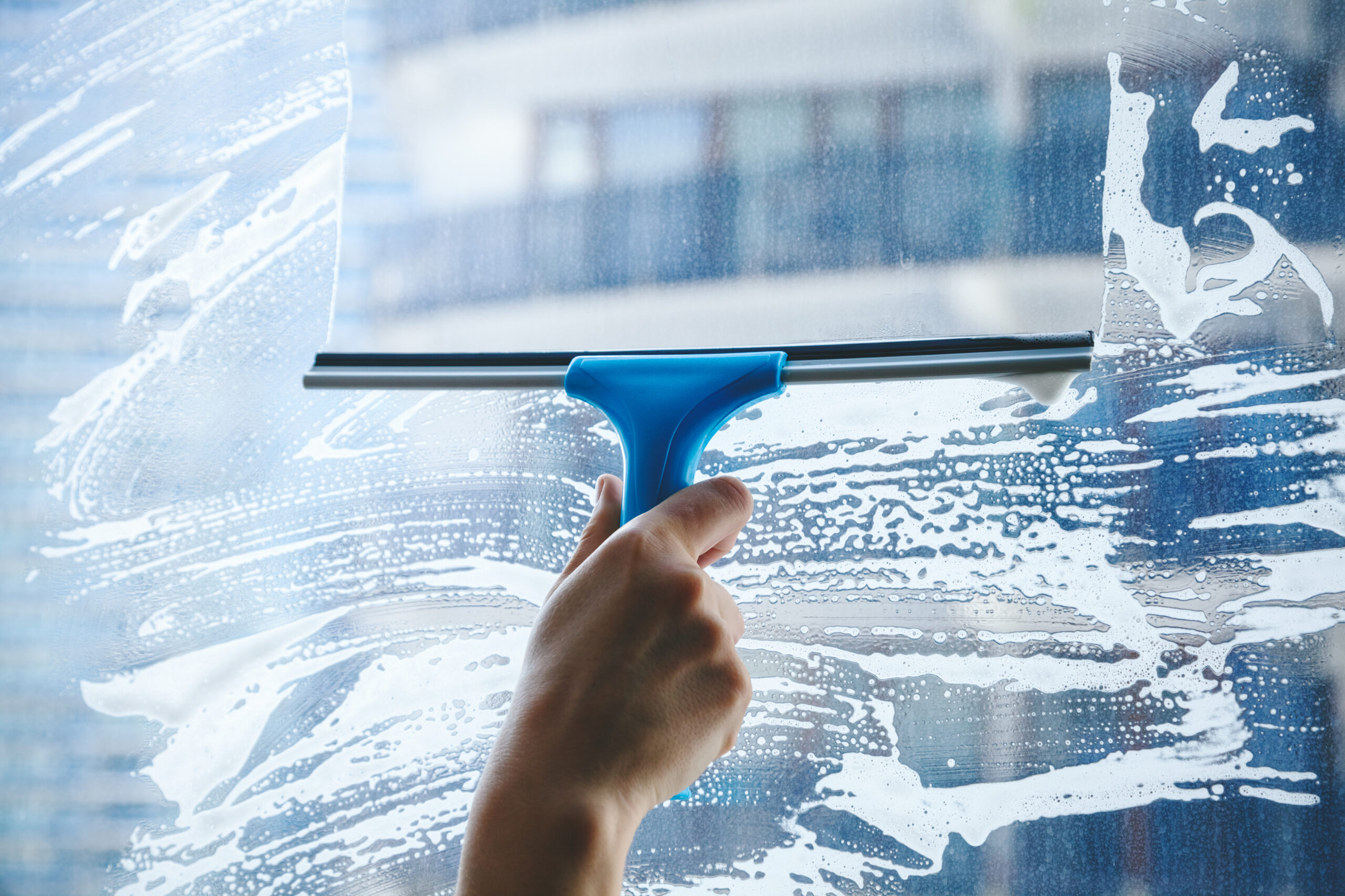 Squeegee cleaning a window